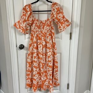 Karlie orange and cream flower midi dress from a Boutique